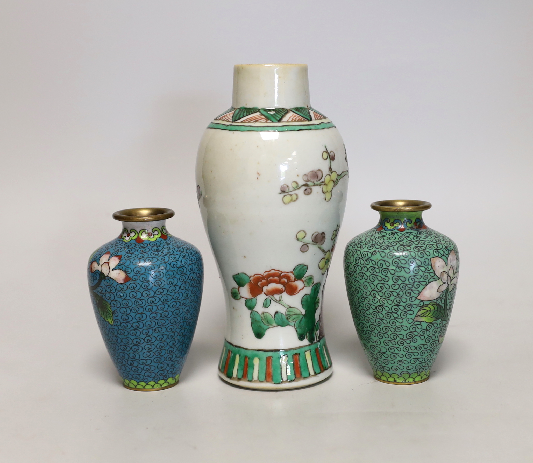 A Chinese famille verte small vase and a pair of cloisonné enamel vases, tallest 18cm high